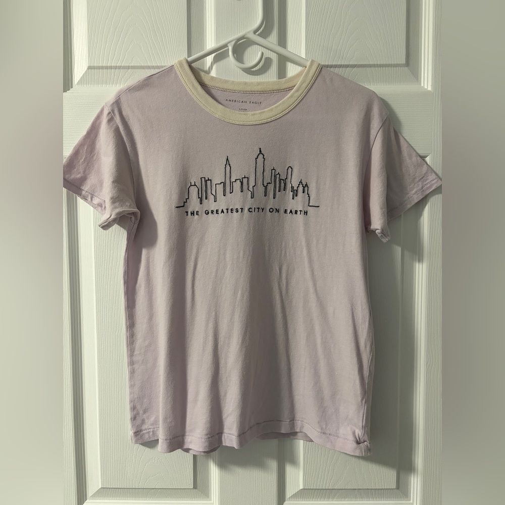 American Eagle “The Greatest City on Earth” Lavender Graphic Tee (Size S)